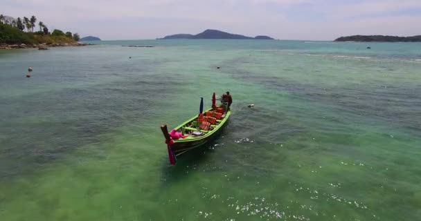 Aerial: Beautiful model is lying on the longtail boat. Thailand. Phuket. — Stock Video