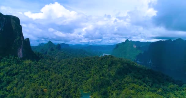 Aerial: Mountain landscape with a lake and a cloudy sky. — Stock Video