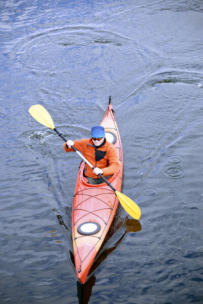 Traveling by kayak on the river on a sunny day.