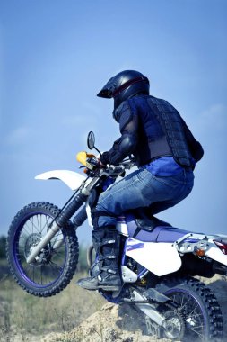 Enduro motorcycle racing .  clipart