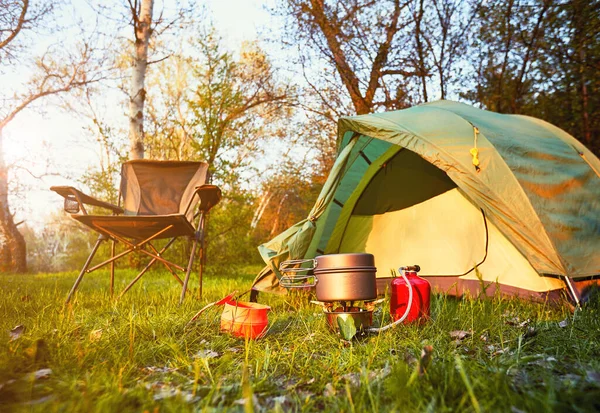 Camping with a tent in the summer in the mountains.