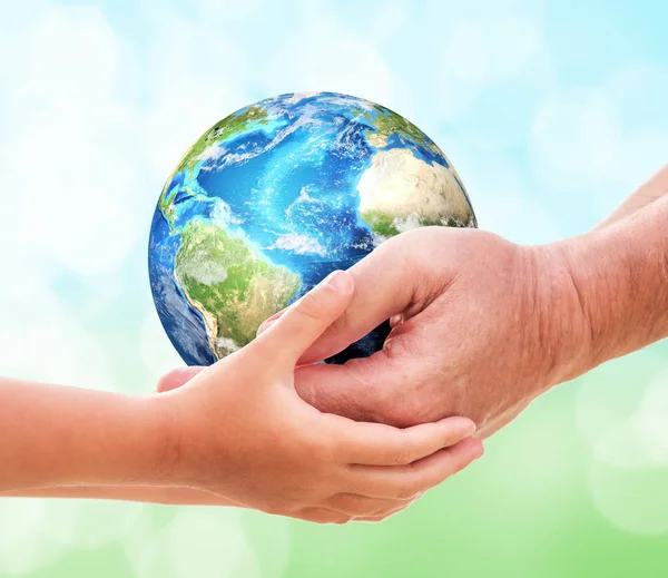 The man gives planet Earth to baby — Stock Photo, Image