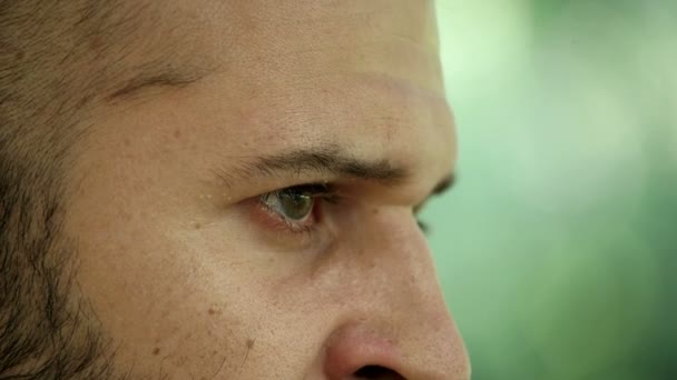 Sad and thoughtful eyes of a caucasian boy — Stockvideo