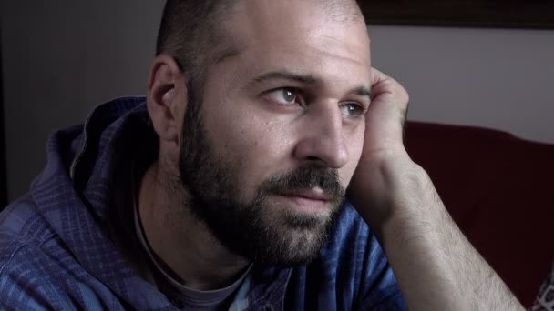 Young bald man deep in thought — Αρχείο Βίντεο