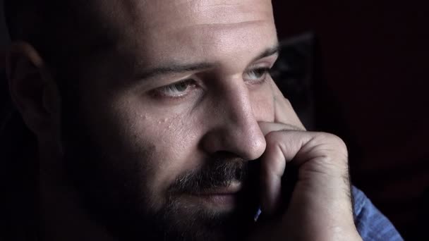 Serious man with beard and absorbed by his thoughts — Stockvideo