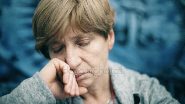 Portrait of sad,pensive mature lady looking at camera — Stock Video