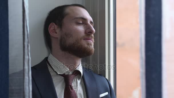 Sad depressed desperate businessman at the window, he just lost his job — Stock Video