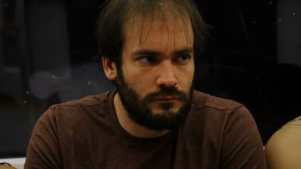 Pensive and serious handsome man sit in a metro wagon — Stock Video