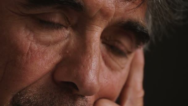 Sad and depressed mature man's eyes, close up — Stock Video