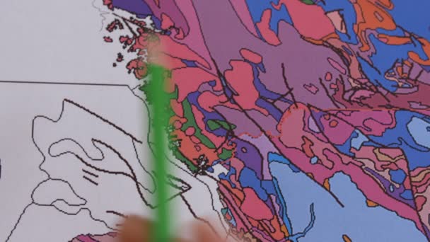 Geologist's hand indicates the earthquake areas — Stock Video
