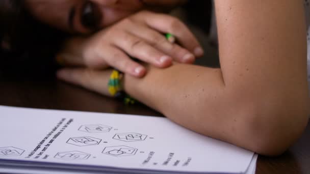 Stressed and tired student leaning against the desk near the difficult test — Stock Video