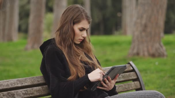 Cute Woman Reads Bad News Tablet — Stock Video