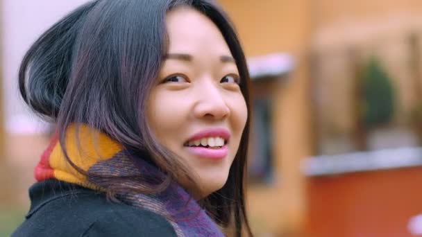 Happy Pretty Chinese Woman Turning Her Head Smiles Camera Outdoor — Stock Video