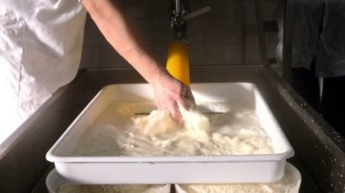 Cheese Factory, making cheese-cheese maker ordering the ricotta molds