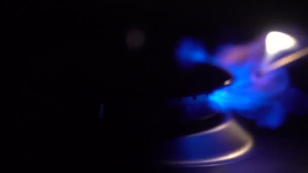 Gas burning from a kitchen gas stove with a match in slow motion — Stock Video