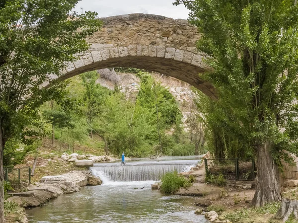 stone bridge of a village in Spain