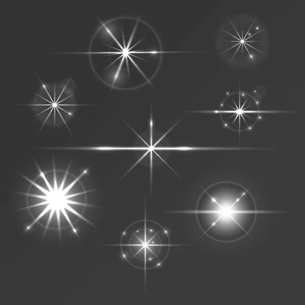 Set glühender Sterne mit Funken und Kreisen — Stockvektor