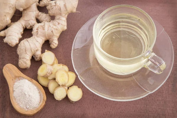 Ginger tea with sliced and ground roots - Zingiber officinale — Stock Photo, Image