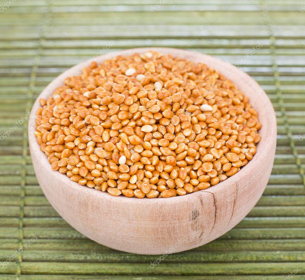 millet, millet seeds in a wooden bowl, top view — Stock Photo
