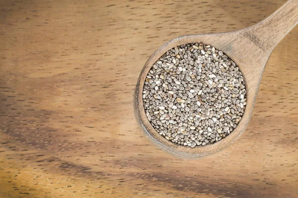 Chia seeds in a wooden spoon - Salvia hispanica — Stock Photo, Image