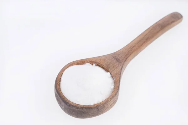 Baking soda (sodium bicarbonate) in a wooden spoon — Stock Photo, Image