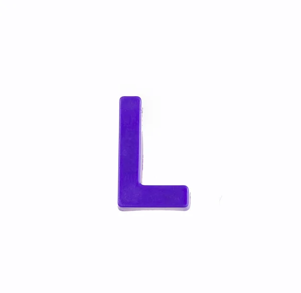 Letter L of the alphabet - Piece in violet plastic — Stock Photo, Image