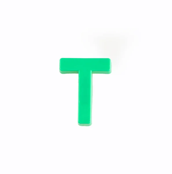 Letter T of the alphabet - Piece in green plastic — Stock Photo, Image