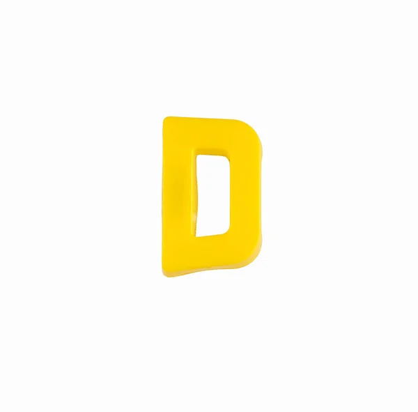 Letter D of the alphabet - Piece in yellow plastic — Stock Photo, Image