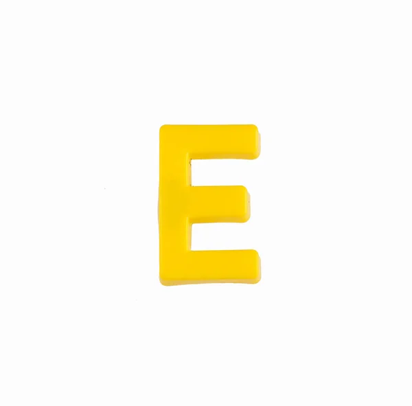 Letter E of the alphabet - Piece in yellow plastic — Stock Photo, Image