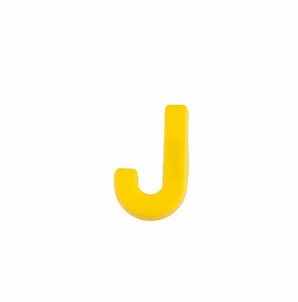 アルファベットの文字J -黄色のプラスチック製のピース — ストック写真