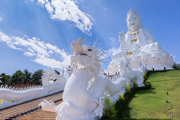 Guan Yin statue and dragon statue with blue sky and clouds sky at Huay Pla Kang Temple, Chiangrai, Thailand. Aerial view of Wat huay pla kang famous place attractions for tourist in Chiang Rai, Thailand.