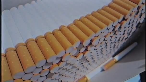 A lot of empty cigarette blanks in a large cardboard box. VHS video footage 1080. — Stock Video