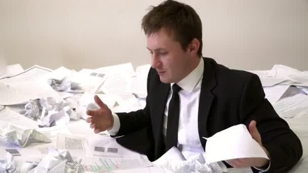The man in the office drowning in paper — Stock Footage The man in the office drowning in paper Stock Video