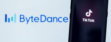 KIEV, UKRAINE - MARCH 3, 2020: TikTok app displayed on smartphone screen with ByteDance logo on background