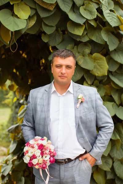 Portrait groom in nature