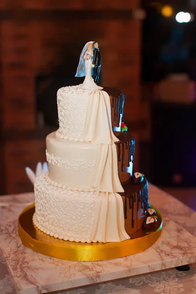 Delicious chocolate cake with figurines — Stock Photo, Image