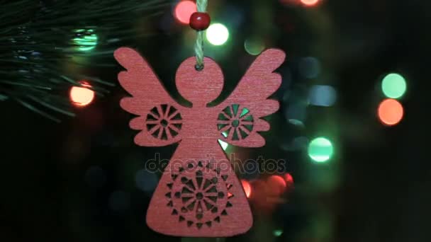 Christmas wooden toy on a Christmas tree. Angel eco Christmas toy — Stock Video