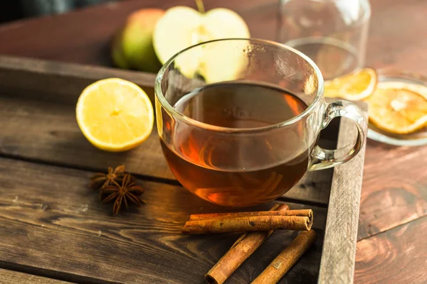 Cup of tea on wooden background with cinnamon, anise stars — Stock Photo, Image