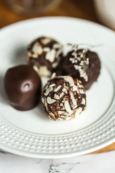 Useful sweets with coconut in chocolate and tea