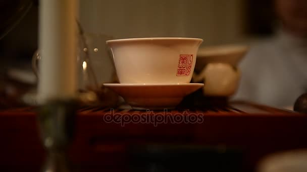 Hot green tea pouring into a bowl. Close. Tea — Stock Video