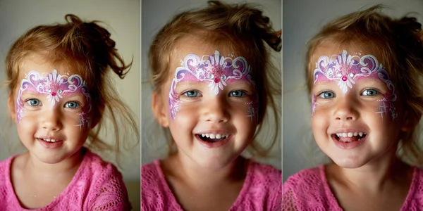 Pretty exciting blue-eyed girl of 2 years with a face painting. Collage — Stock Photo, Image