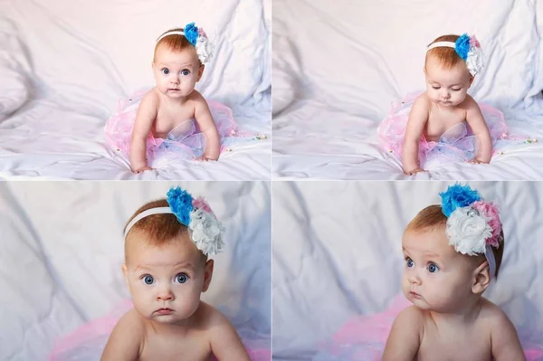 Bebé recién nacido con una corona de ganchillo blanco, tutú bailarina, y zapatillas de ballet. Ella está durmiendo en rosa rosa tela de la cinta . —  Fotos de Stock