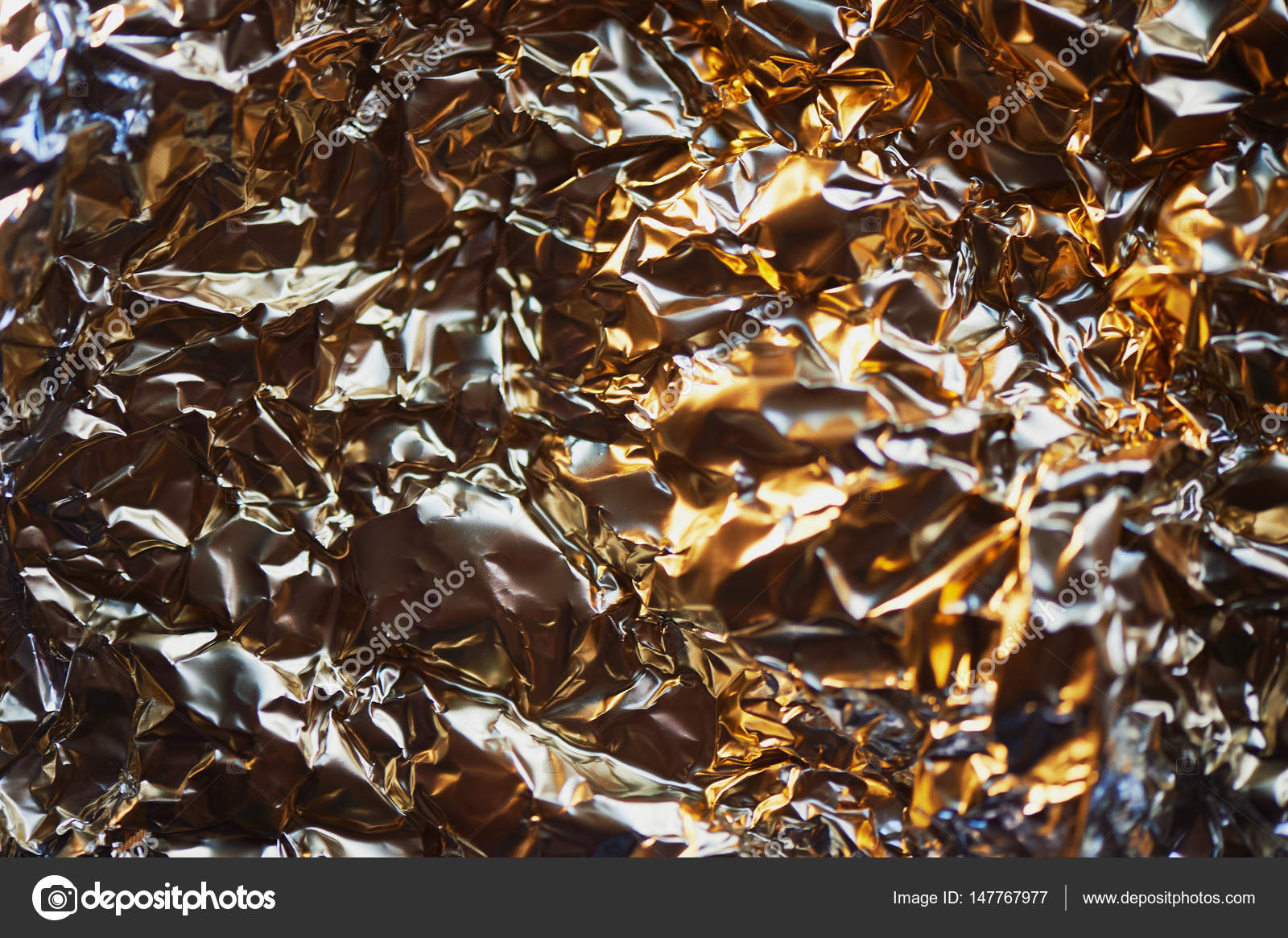 Aluminum foil texture. Glide view. Gold Stock Photo by ©gf2002.mail.ru  147767977