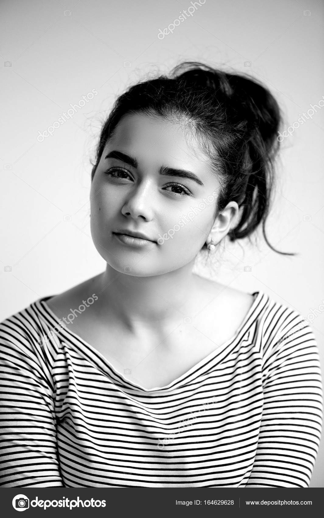 Portrait Of Young Beautiful Girl With Brown Eyes And Black Hair