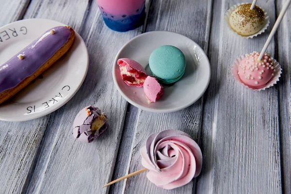Beautiful sweets pastel shades on a beautiful wooden background.Aesthetic picture. dining, cooking, for childrens parties