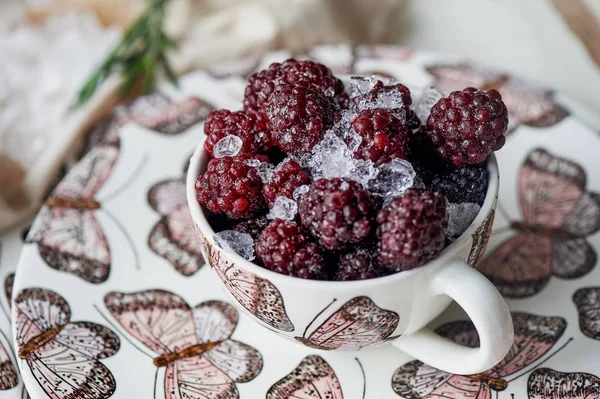 BlackBerry in a Cup covered with crushed ice.Light and healthy snack, Breakfast and dessert