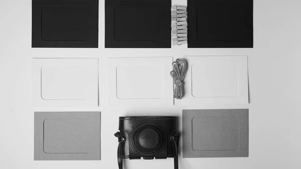 Storage and archiving of photos.Paper frames for photos, an old film camera in the case. Preserving your history. Photo Art. — 스톡 사진