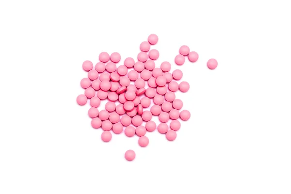 Růžové pilulky izolované na bílém pozadí. — Stock fotografie