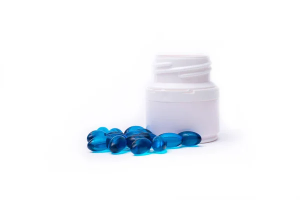 Blue pills and medicine bottle isolated on white background. — Stock Photo, Image