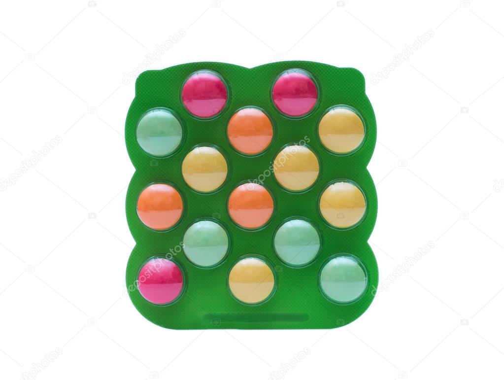 Colorful Pills for Kids in the plastic packaging isolated on white background.